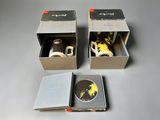 two boxes with a pair of shoes inside of them on a table