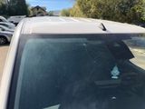 a car with a broken windshield and a broken window