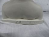 a white vase sitting on top of a white table