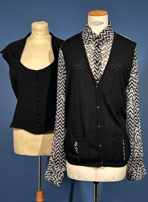 two mannequins and a jacket on a mannequin stand
