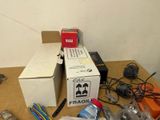 a table with a box and many other items on it