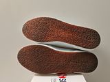 a pair of shoes that are on top of a box