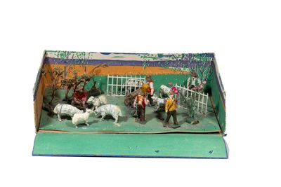 a box that has some figurines of people in it