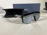 a pair of sunglasses sitting on a table next to a pair of glasses