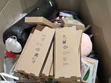 a cardboard box filled with boxes and other items