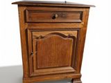 an image of a small wooden cabinet with a drawer