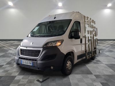 a white van that is parked on a checkered floor