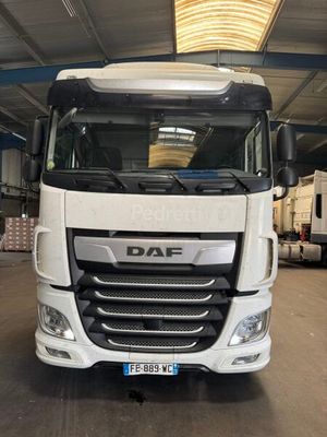 a picture of a white truck parked in a garage