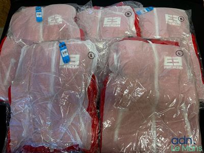 four bags of meat wrapped in plastic sitting on top of a table