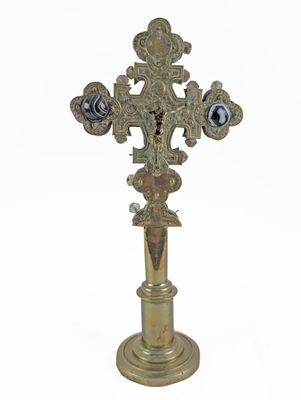 an image of a cross on a pedestal on a white background