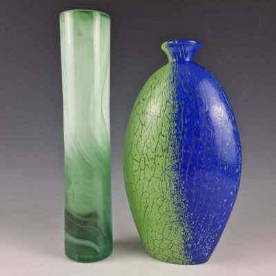 two vases sitting next to each other on a table