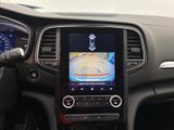 the dashboard of a car with a gps device in the center of it