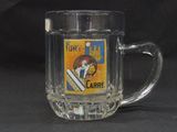 a glass mug that has a picture of a man on it