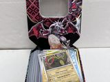 a close up of a box of pokemon trading cards on a table