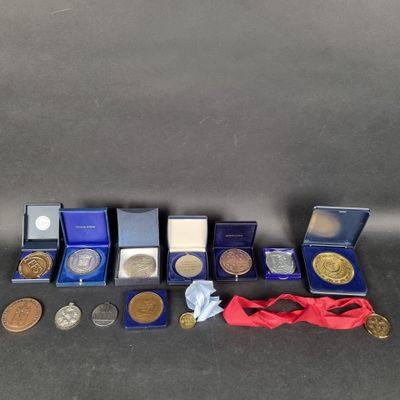 some of the medals and medals are on display on the table