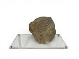 a rock that is sitting on top of a glass plate