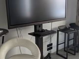 a flat screen tv sitting on top of a stand in a living room