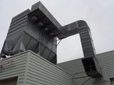 an image of a building with a metal structure on top of it