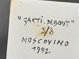an old book with writing on it sitting on top of a table