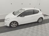 a picture of a small white car parked in a garage