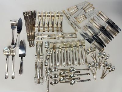 a lot of silverware on a table with a fork and knife