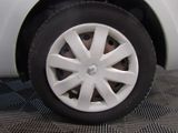 a close up of a tire on a white car