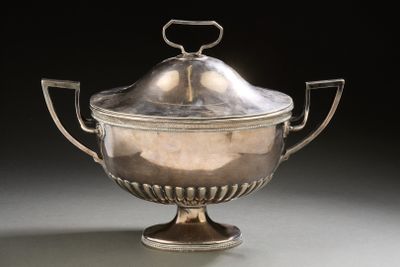 an antique silver plated bowl with a lid and handles