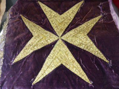 a purple blanket with a gold star on it