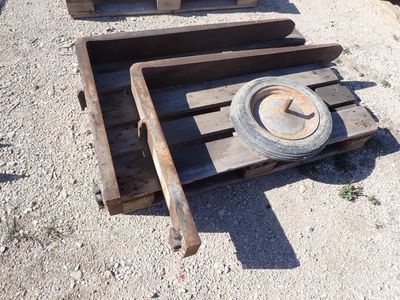 two wooden pallets that have wheels on them