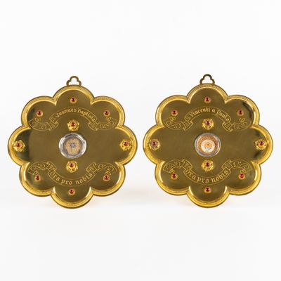 pair of gold plated earrings with red and white stones