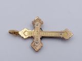 an image of a gold cross on a white background