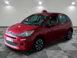 the red citrole is parked on a checkered floor