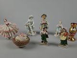 five figurines that are sitting on a table
