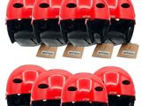 six red and black helmets are lined up on a cardboard box