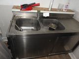 a sink and a counter in a small room