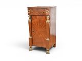 an image of a small wooden cabinet with a door