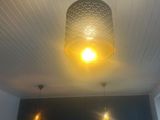 a lamp that is hanging from the ceiling in a room
