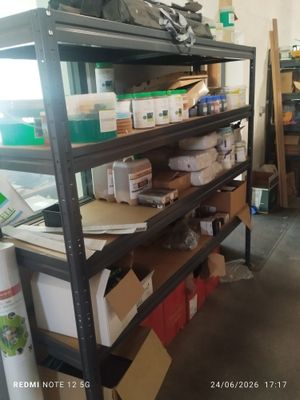many boxes and boxes on the shelves in the room