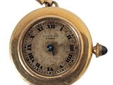 an image of a close up of a wrist watch with roman numerals