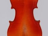 an old violin with a wooden back and bow on a white background