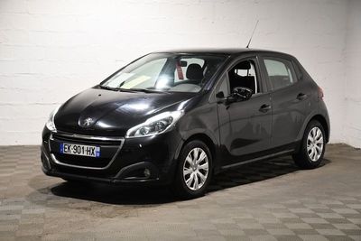 a picture of a small black car parked in a garage