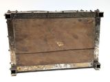 an old wooden box with a metal frame on it