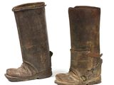 pair of old leather boots on a white background