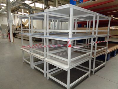 many shelves that are in the middle of a room