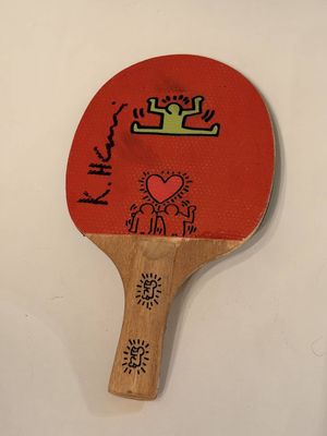 a ping pong paddle with a drawing on it