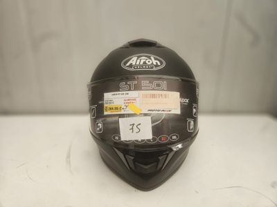 the helmet is black and has a sticker on it