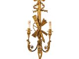 Applique à deux bougies en feuille d'or sur fond blanc
