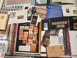 a lot of stamps and postcards on the table