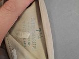 a person that is putting something inside of a purse