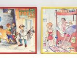 deux livres pour enfants exposés sur le mur